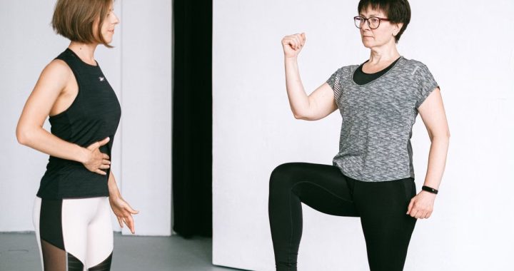 Two women working out together, demonstrating fitness exercises on a white background.